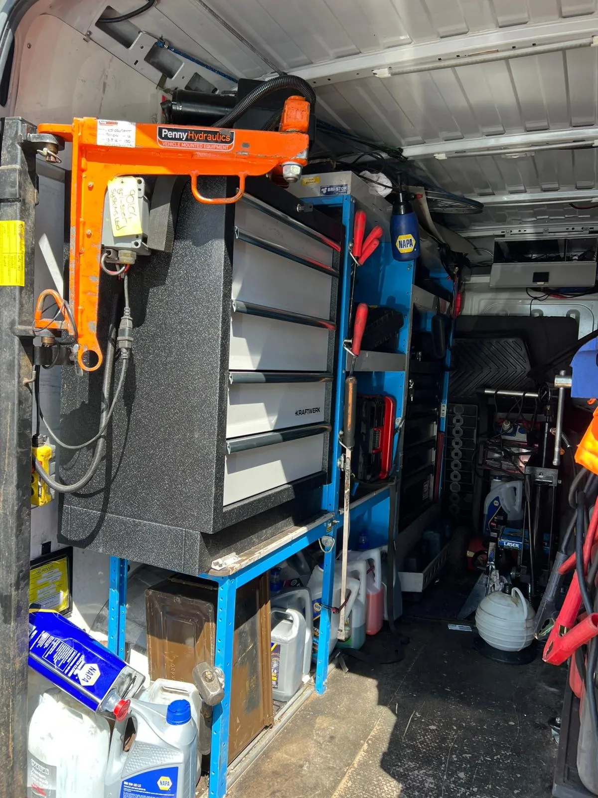 Inside the workshop van: tool drawers and vehicle-mounted lifting crane