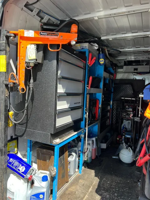 Inside the workshop van: tool drawers and vehicle-mounted lifting crane